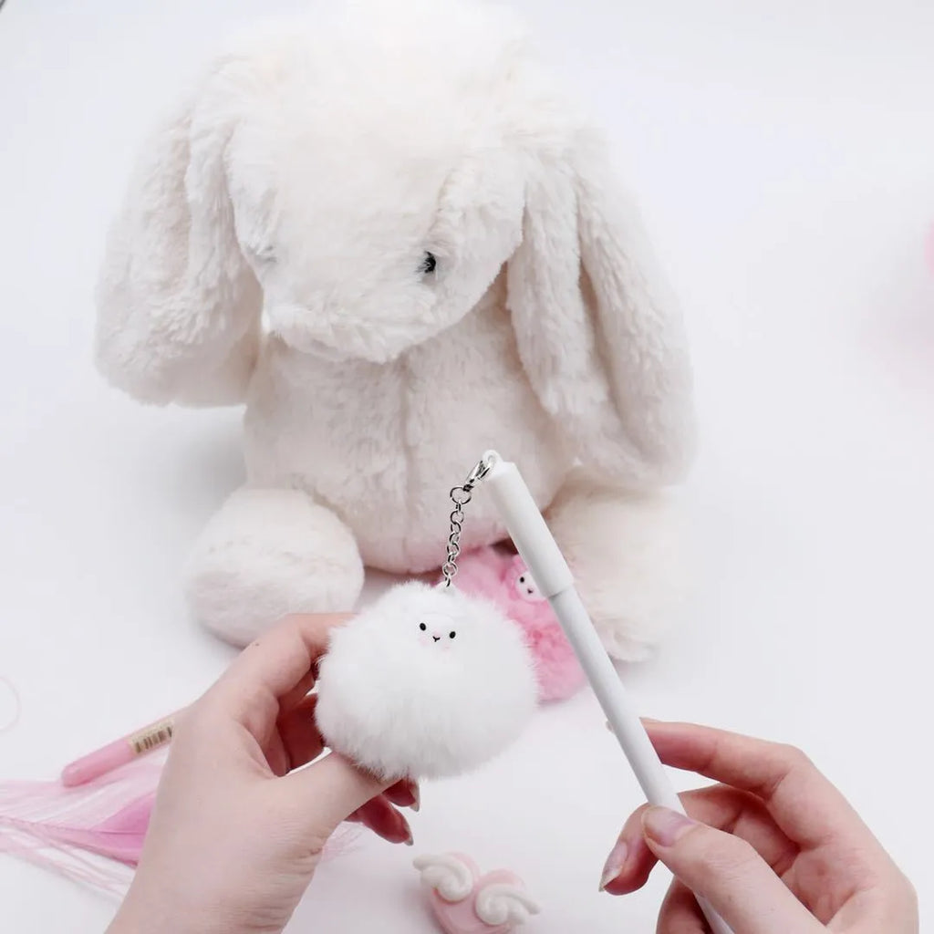 Alpaca hair ball pendant pen with 0.5mm tip and plastic barrel at 17cm length on a flat surface
