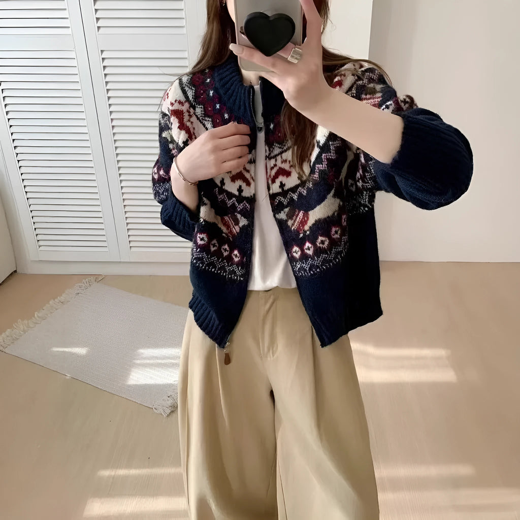 Women's ethnic jacquard pullover sweater with 3D pattern in beige apricot, showing loose fit and long sleeves.