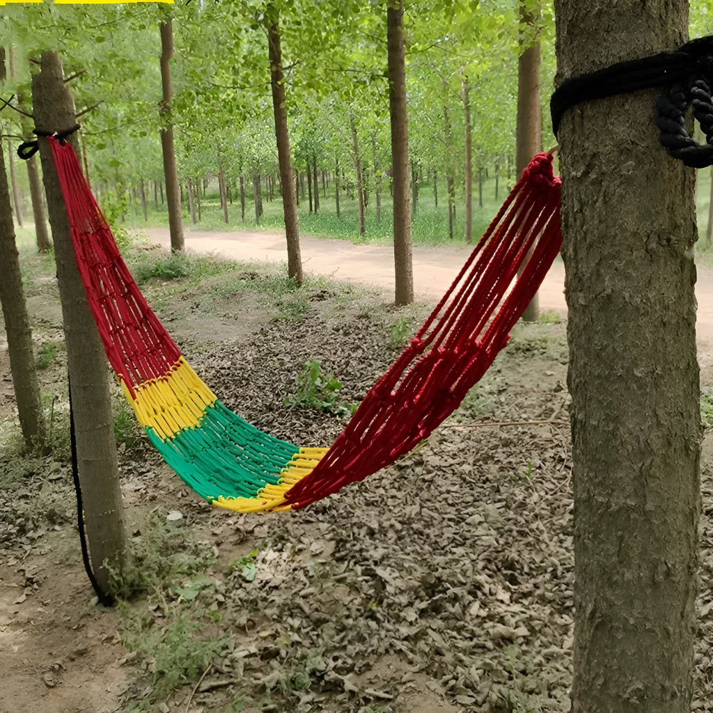 Nylon rope mesh hammock suspended between trees showing mesh pattern and included tying equipment
