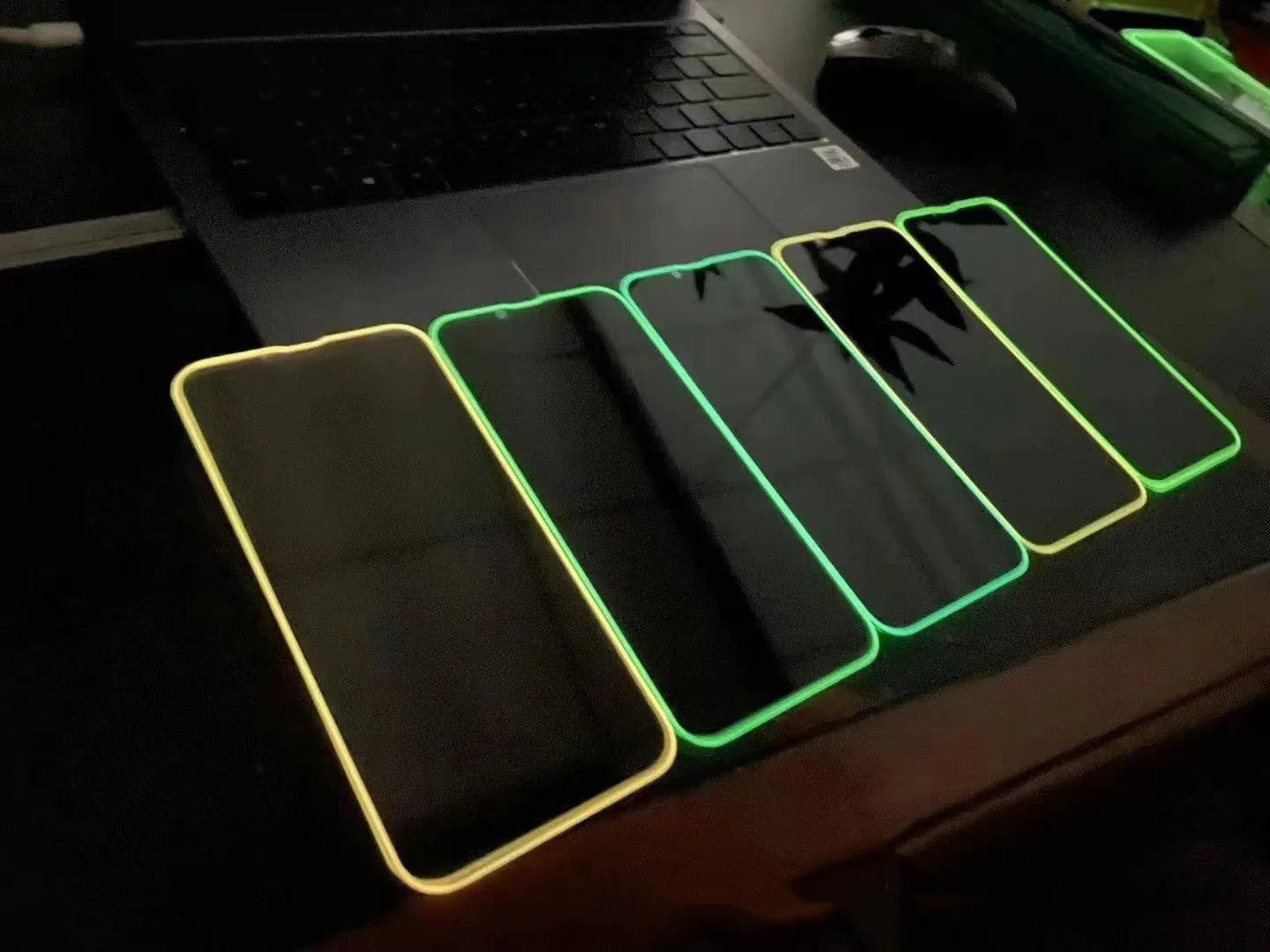 Fluorescent tempered glass screen protector for iPhone showing luminous pink, yellow, green, blue and grass green colour options.