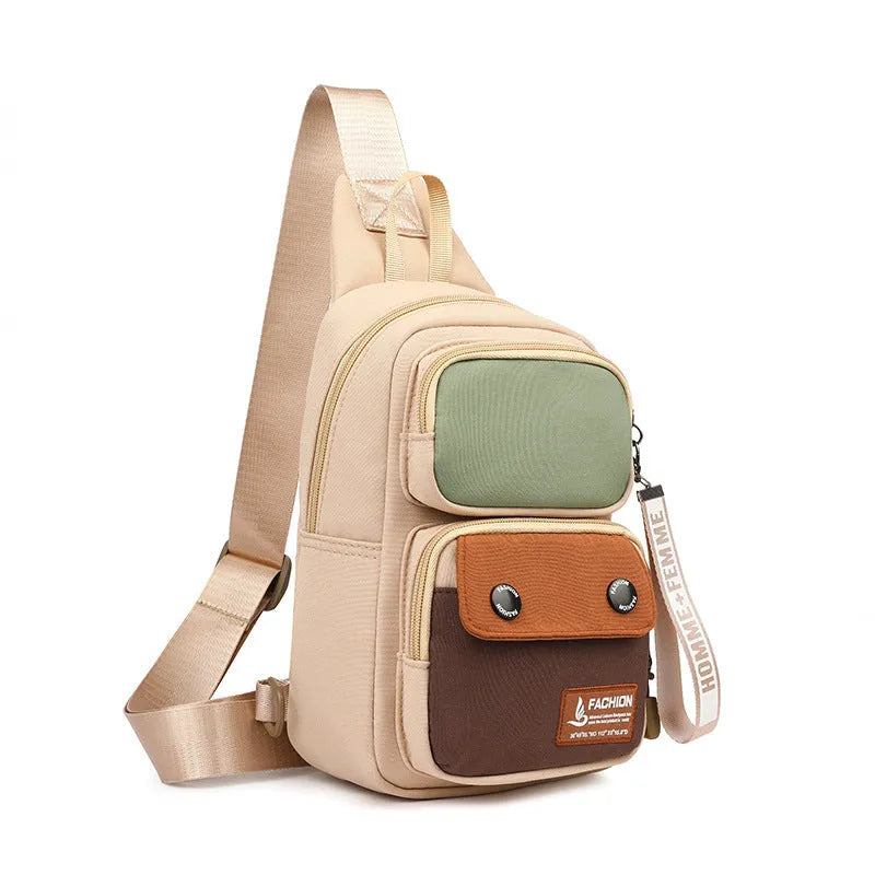 Black nylon crossbody shoulder bag with beige contrast stitching and multiple storage compartments