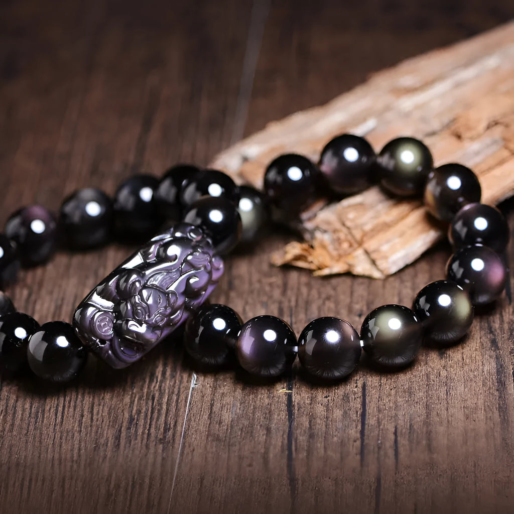 Polished icy obsidian crystal Pi Xiu bracelet with geometric beads in multiple sizes