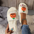 Pumpkin-themed plush slippers with synthetic fur upper and anti-slip PVC sole