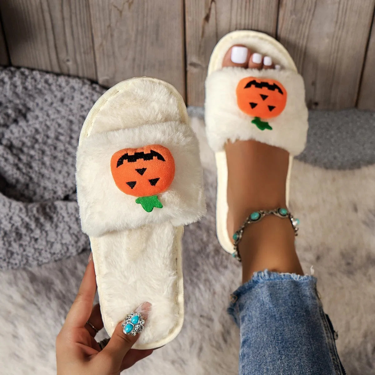 Pumpkin-themed plush slippers with synthetic fur upper and anti-slip PVC sole