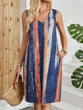 V-neck sleeveless striped dress with colour block pattern in midi length