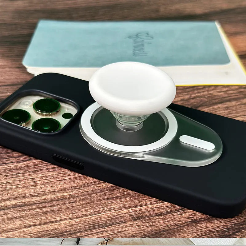 Magnetic suction telescopic folding phone bracket in white colour on desktop
