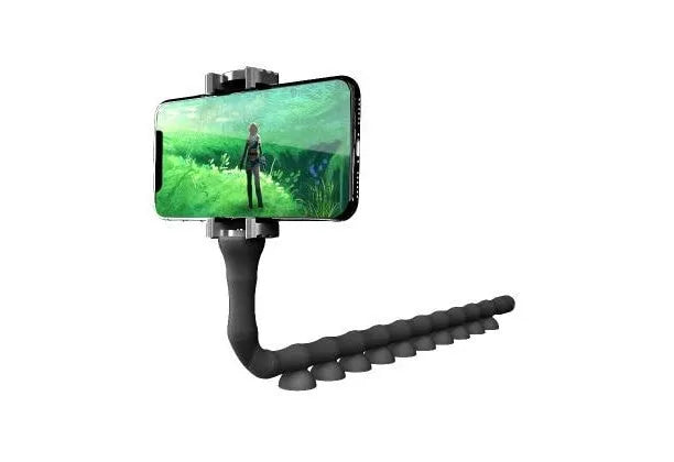 Flexible black suction cup phone holder bent into position on a desktop
