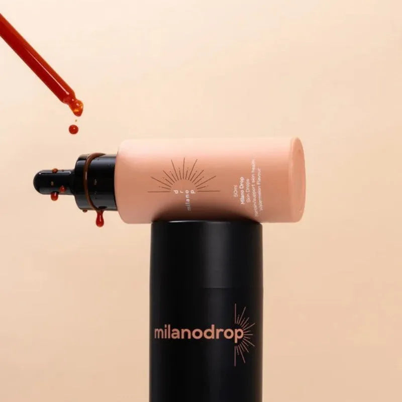 Matte sun tanning black liquid bottle and tube showing 50ml tanning drops and 75ml flash cream.