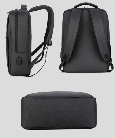 Black waterproof laptop backpack with USB port open, showing padded laptop compartment and internal pockets.