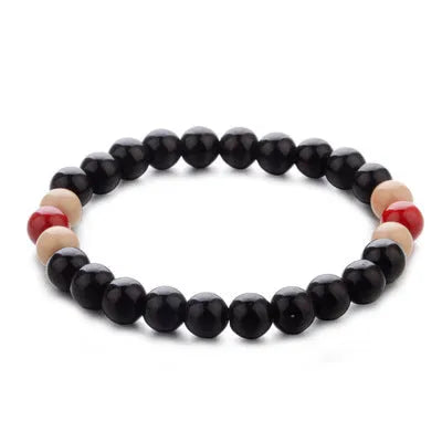 Natural stone beaded bracelet with ethnic design showing lava beads for essential oils