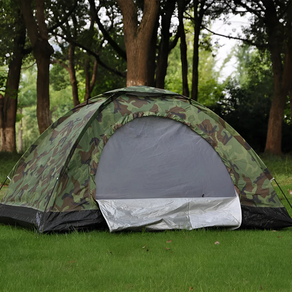 Double camouflage pattern tent pitched outdoors with triangular skylight visible