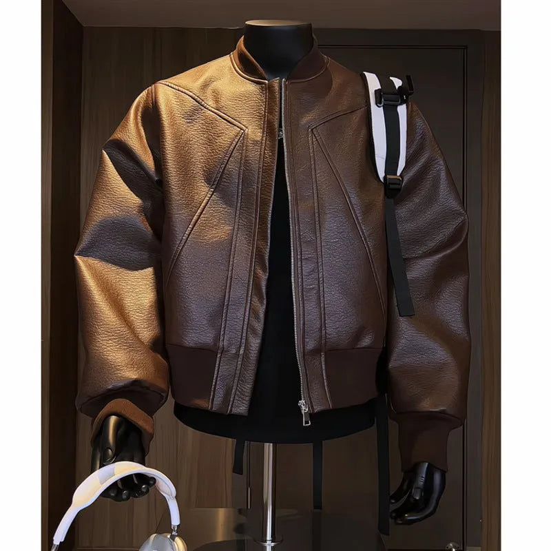 Man wearing a black slim-fit extended length PU leather jacket with a litchi pattern texture.