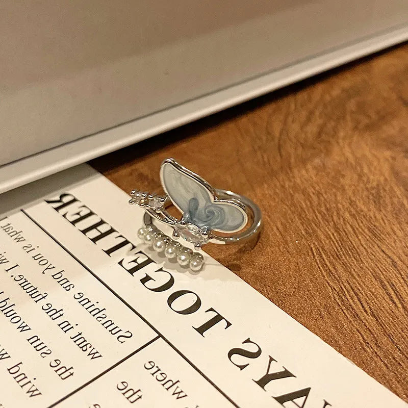 Women's copper butterfly ring with dripping oil finish and adjustable open loop design