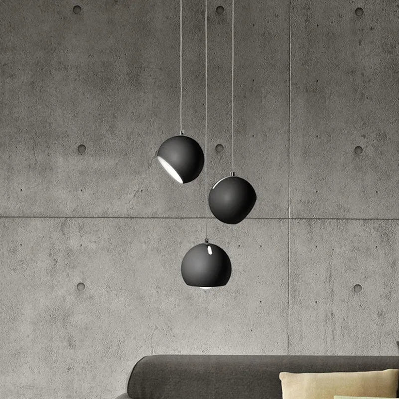 Modern Nordic-style ball chandelier table lamp in Moon White finish on a wooden surface.