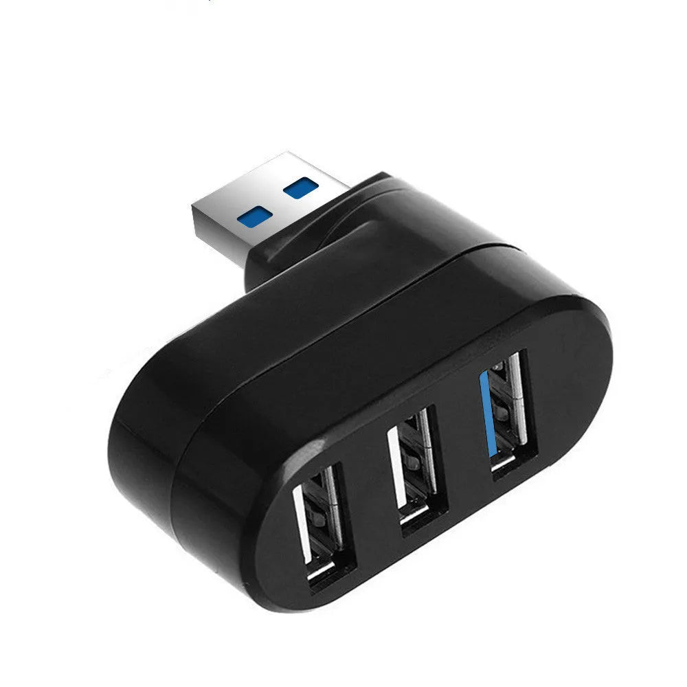 Black or white USB rotary splitter hub with four USB 3.0 ports on a desk.