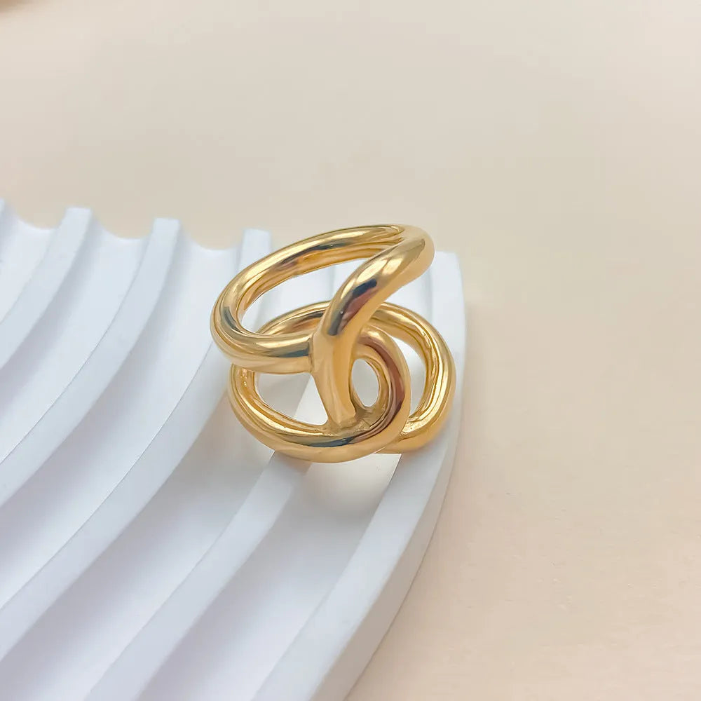 Geometric knot ring with U-shaped profile in stainless steel with adjustable opening mechanism