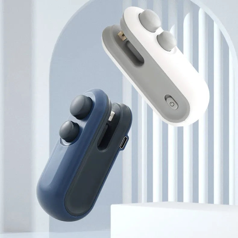 White and blue handheld USB rechargeable heat sealer with cutter blade.