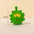 Four colourful squeaky dog balls with cute faces on natural latex rubber with bumpy dental-cleaning surface