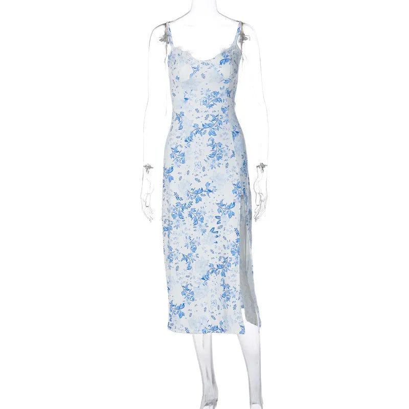 Blue lace flowers print long dress with spaghetti straps and a high leg slit on a mannequin.