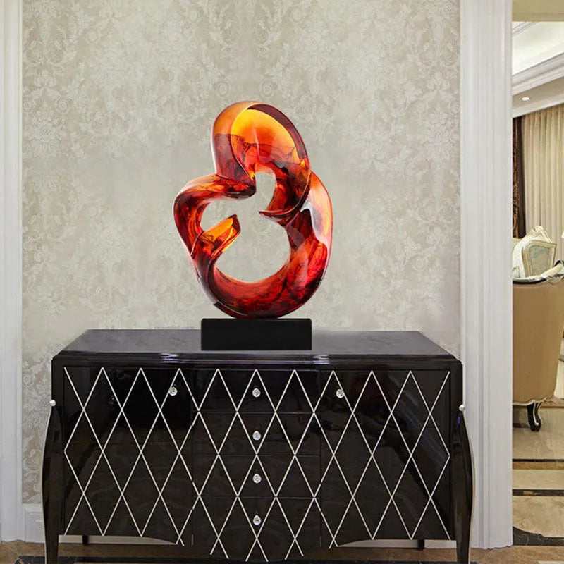 Transparent resin craft ornament in modern simplicity style on a shelf, shown in blue and orange red colour options.