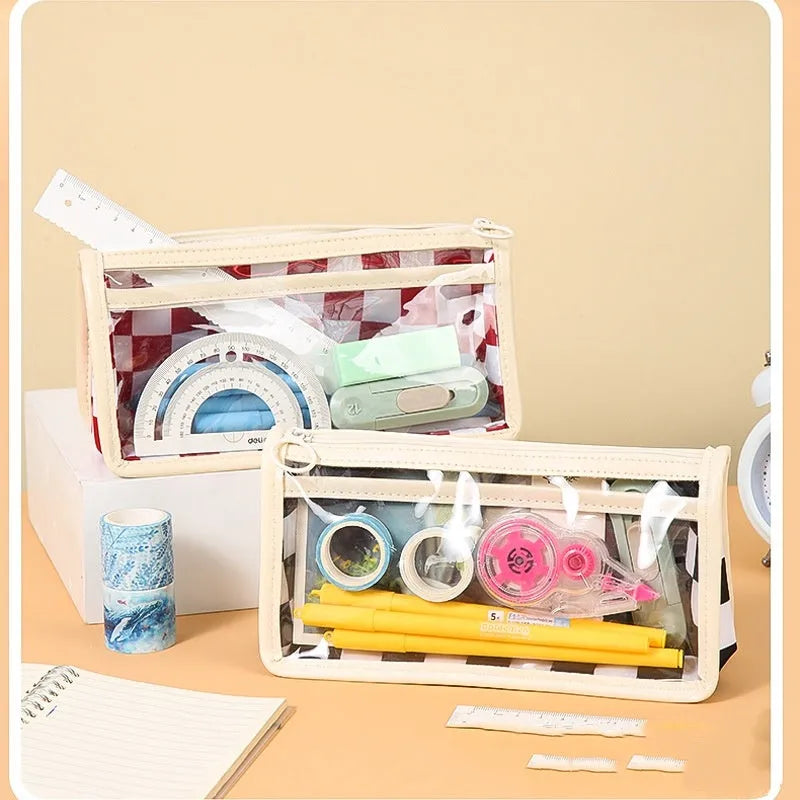 Large transparent PVC pencil case with a chessboard pattern, showing pens inside.