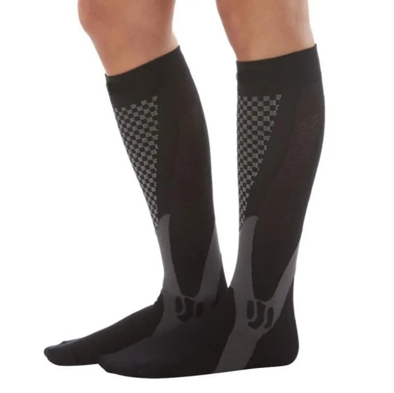 Black graduated compression socks with athletic fit for men and women, shown laid flat.