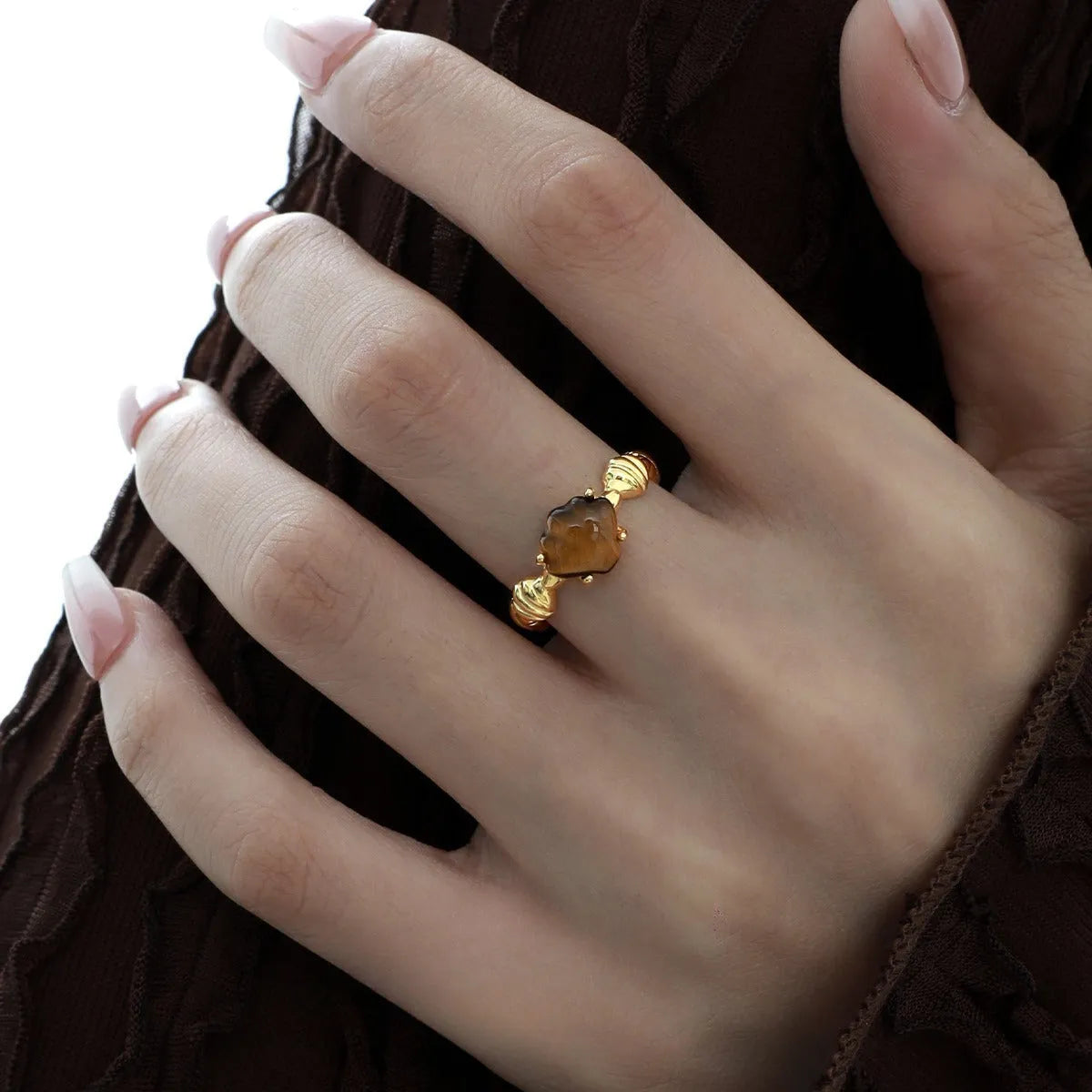 Women's adjustable sterling silver ring with shell decoration and tiger eye stone in original cold-style design