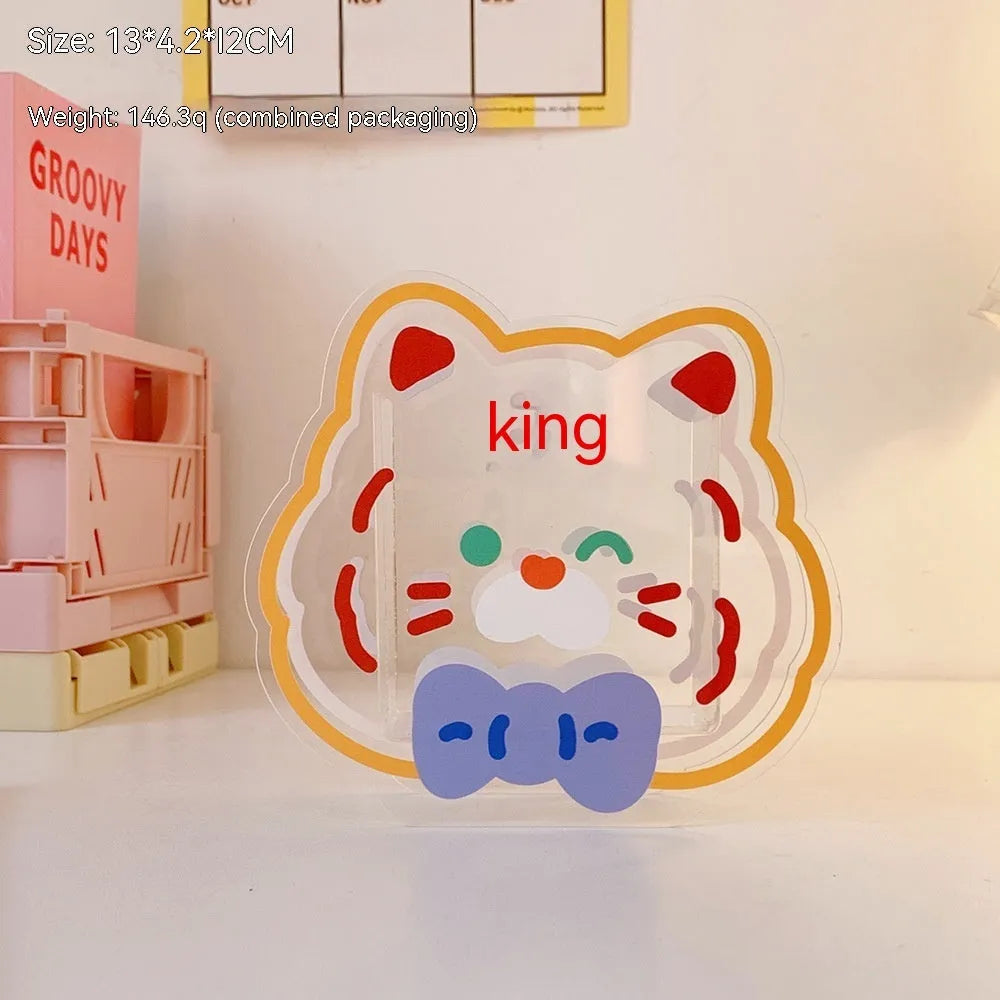Clear square acrylic storage box with a cute decorative pattern, for stationery on a desk.