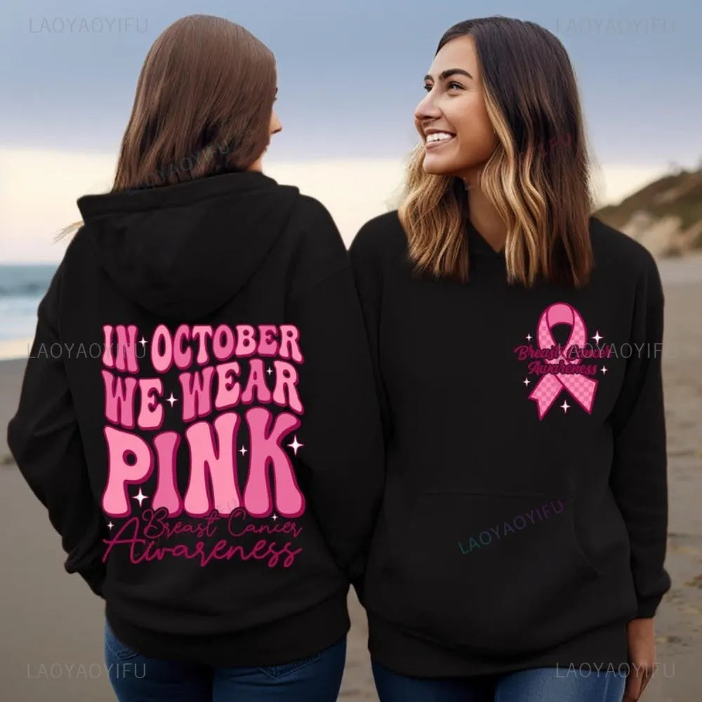 Breast Cancer Awareness pullover hoodie with retro art print and side seam pockets, shown in pink.