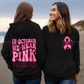 Breast Cancer Awareness pullover hoodie with retro art print and side seam pockets, shown in pink.