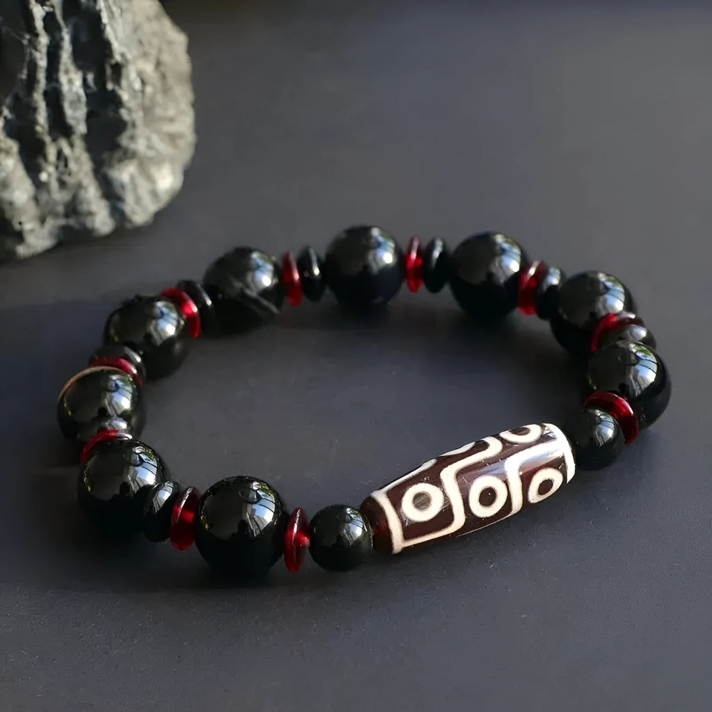 Black agate Dzi bead bracelet with geometric 11mm beads on wrist