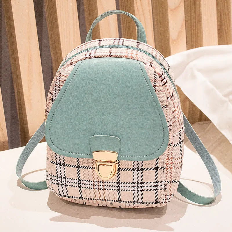 Diagonal shoulder phone bag in PU material showing adjustable strap and handheld carry option