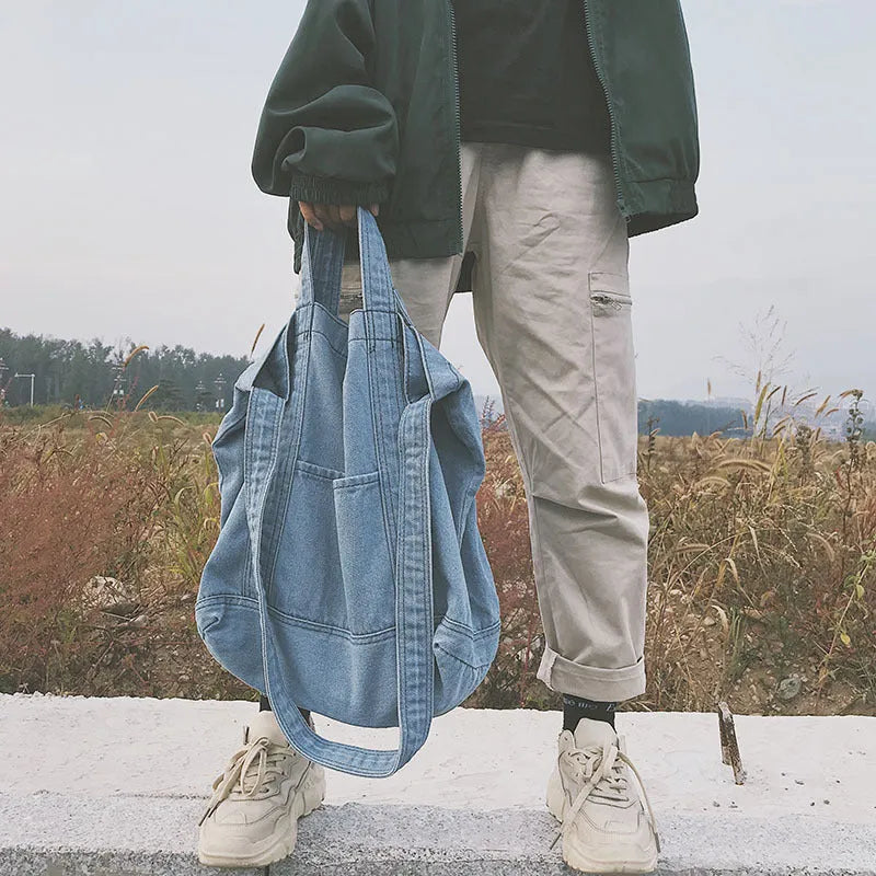 Large canvas denim tote bag in dark blue with polyester lining and horizontal square shape