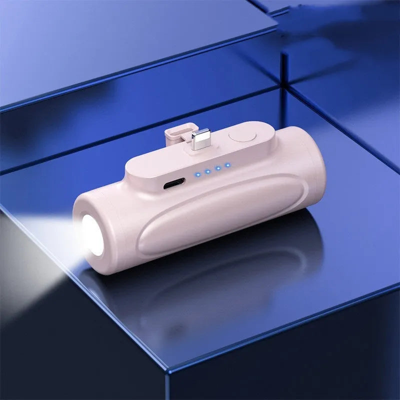 Black and pink creative power bank with integrated LED flashlight, showing Type-C and Apple port options, 83mm long.