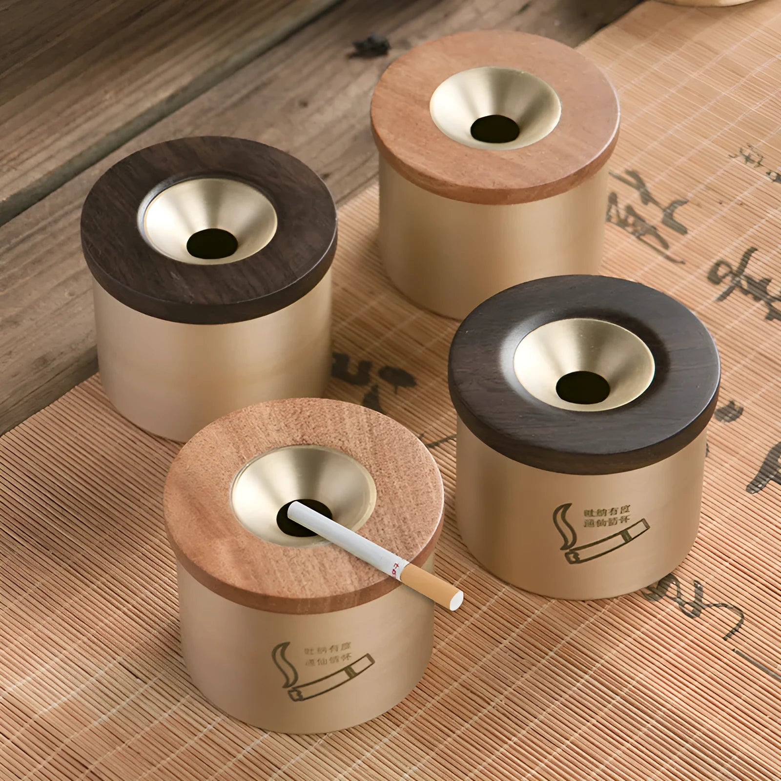 Brass ashtray with a wooden lid featuring a central hole, shown in black wood and red wood options.