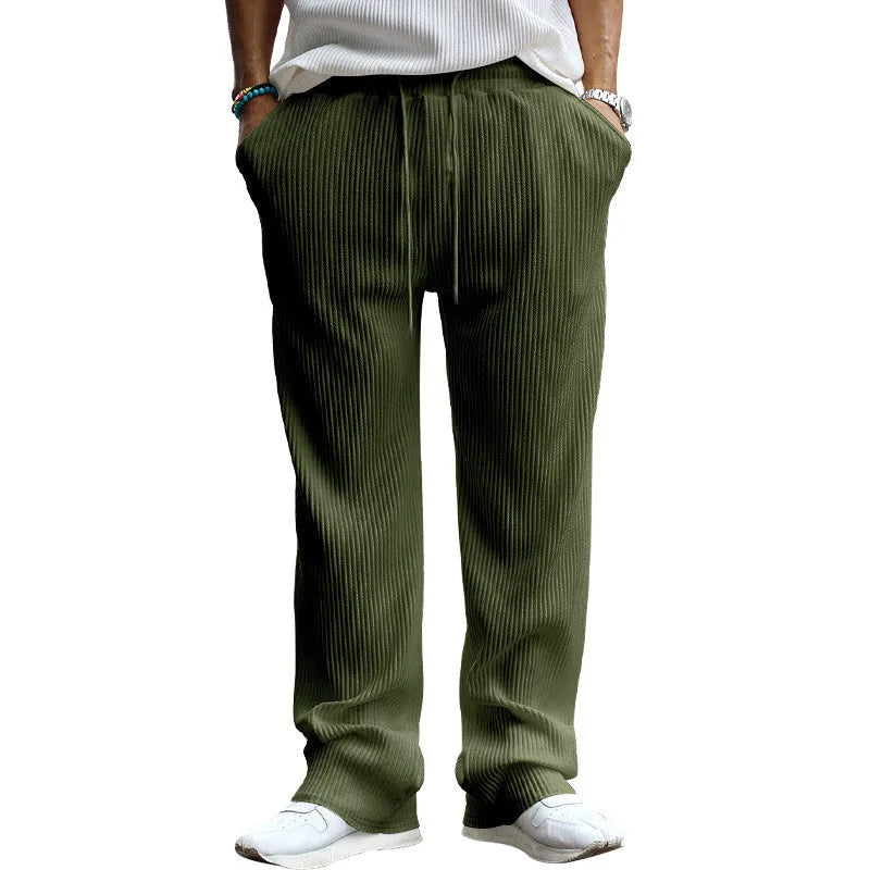 Man wearing army green striped high-waist straight-leg casual trousers.