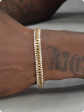 Gold tennis bracelet with artificial gemstones on titanium steel base for men and women