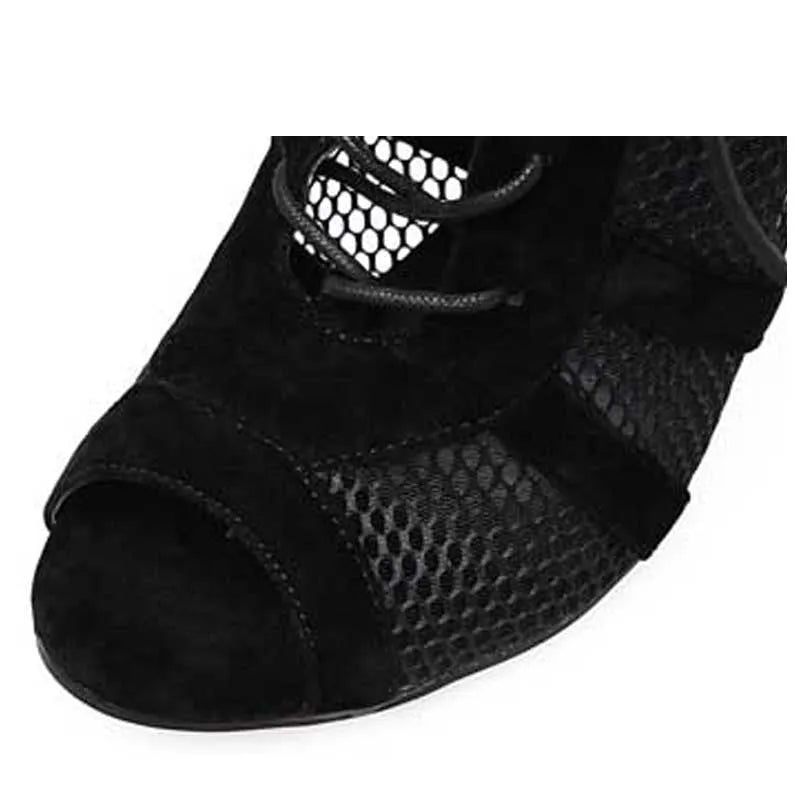Black suede lace-up high heel women's shoes with 11.5cm heel on wooden surface