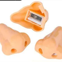 Flesh colour plastic pencil sharpener with geometry shape measuring 58x45x30 mm