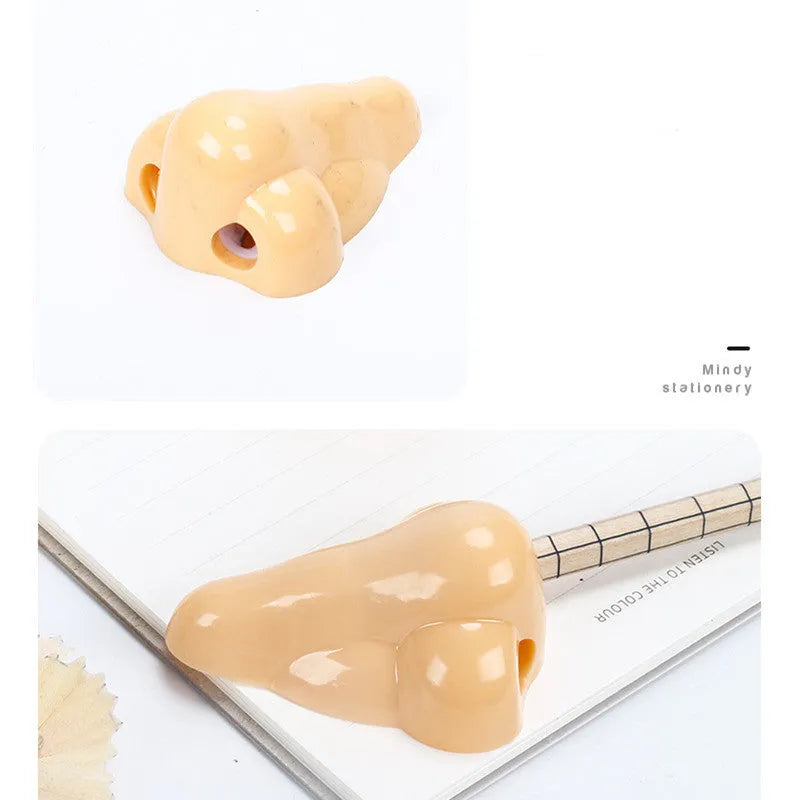 Flesh colour plastic pencil sharpener with geometry shape measuring 58x45x30 mm