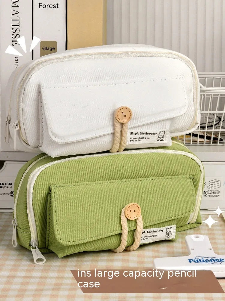 Korean style canvas pencil case in green colour showing large capacity for multiple pens