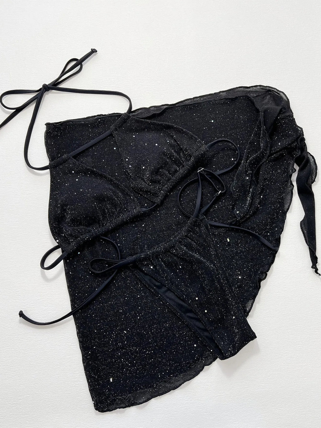 Black three-piece bikini swimsuit set with crop top and shorts on a mannequin.