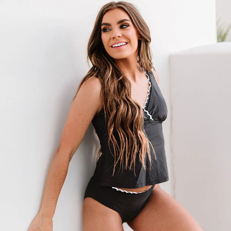 Solid black women's sleeveless bikini swimsuit set on a mannequin.