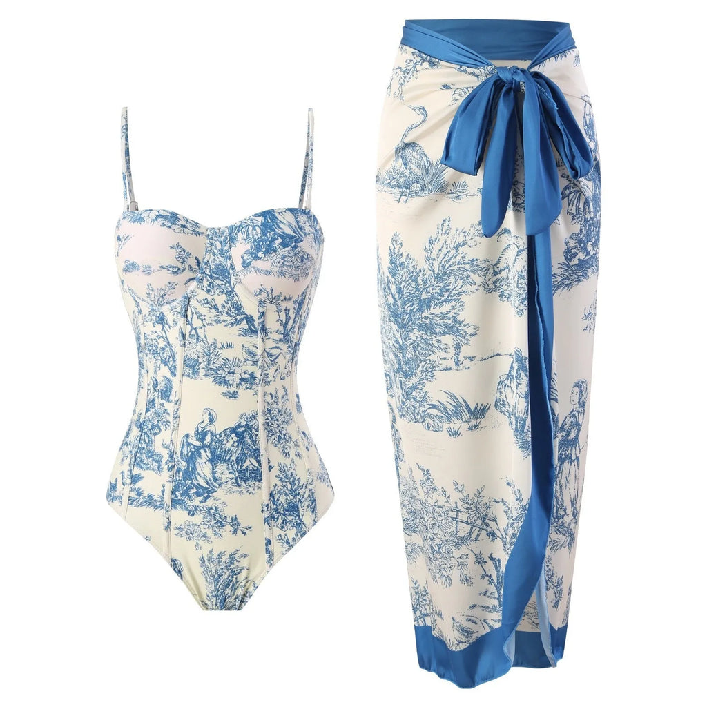 Blue women's one-piece swimsuit with a matching gauze skirt on a size chart background