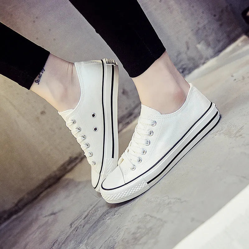 Solid colour women's casual canvas slip-on shoes on a white background, showing the simple design and canvas upper material.