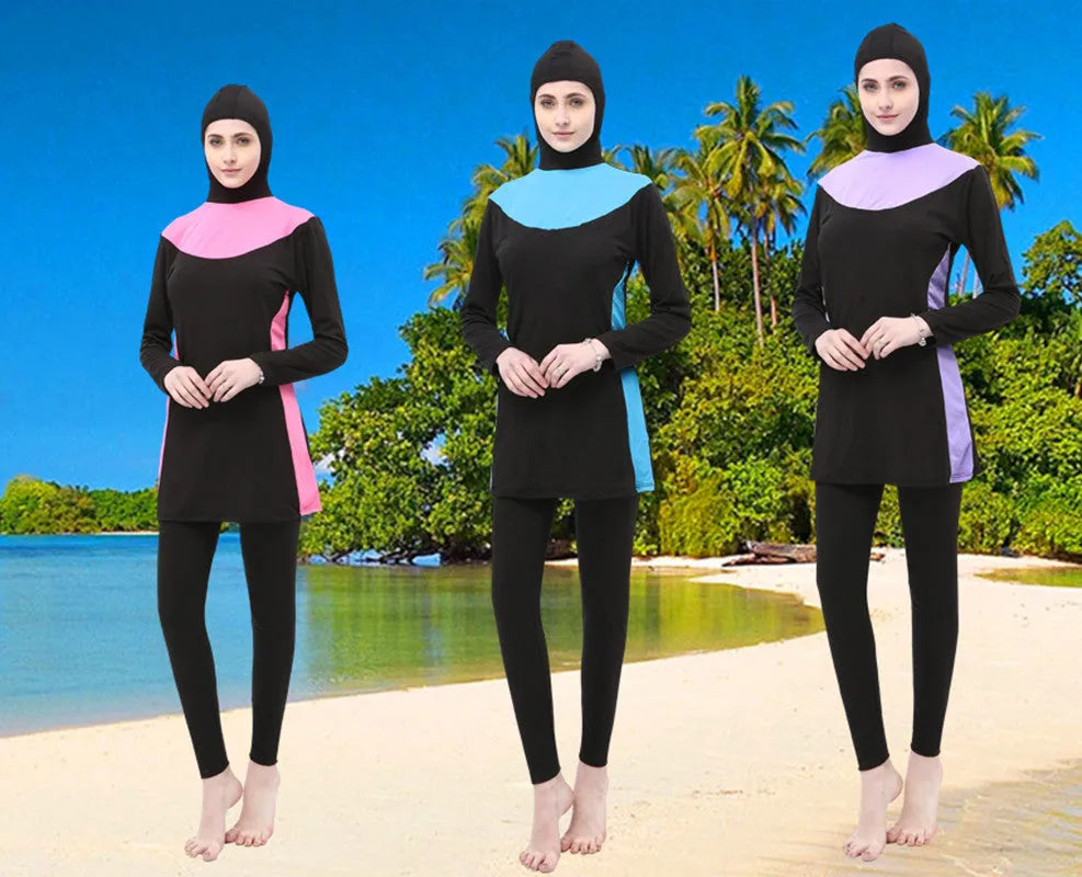 Conservative women's long sleeve swimsuit with hood in black and rose red, showing separate top and trousers.