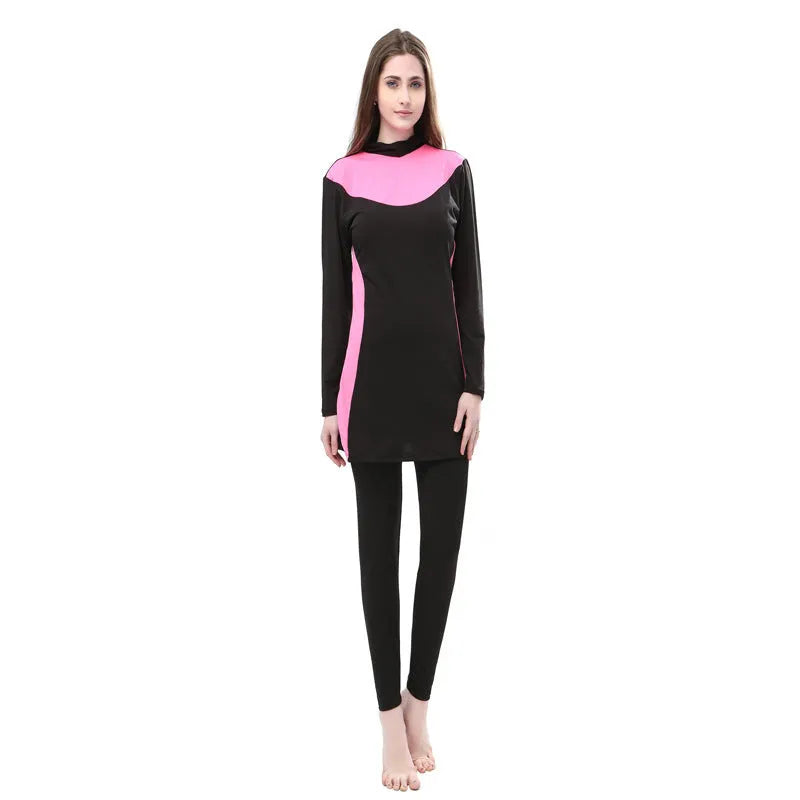 Conservative women's long sleeve swimsuit with hood in black and rose red, showing separate top and trousers.
