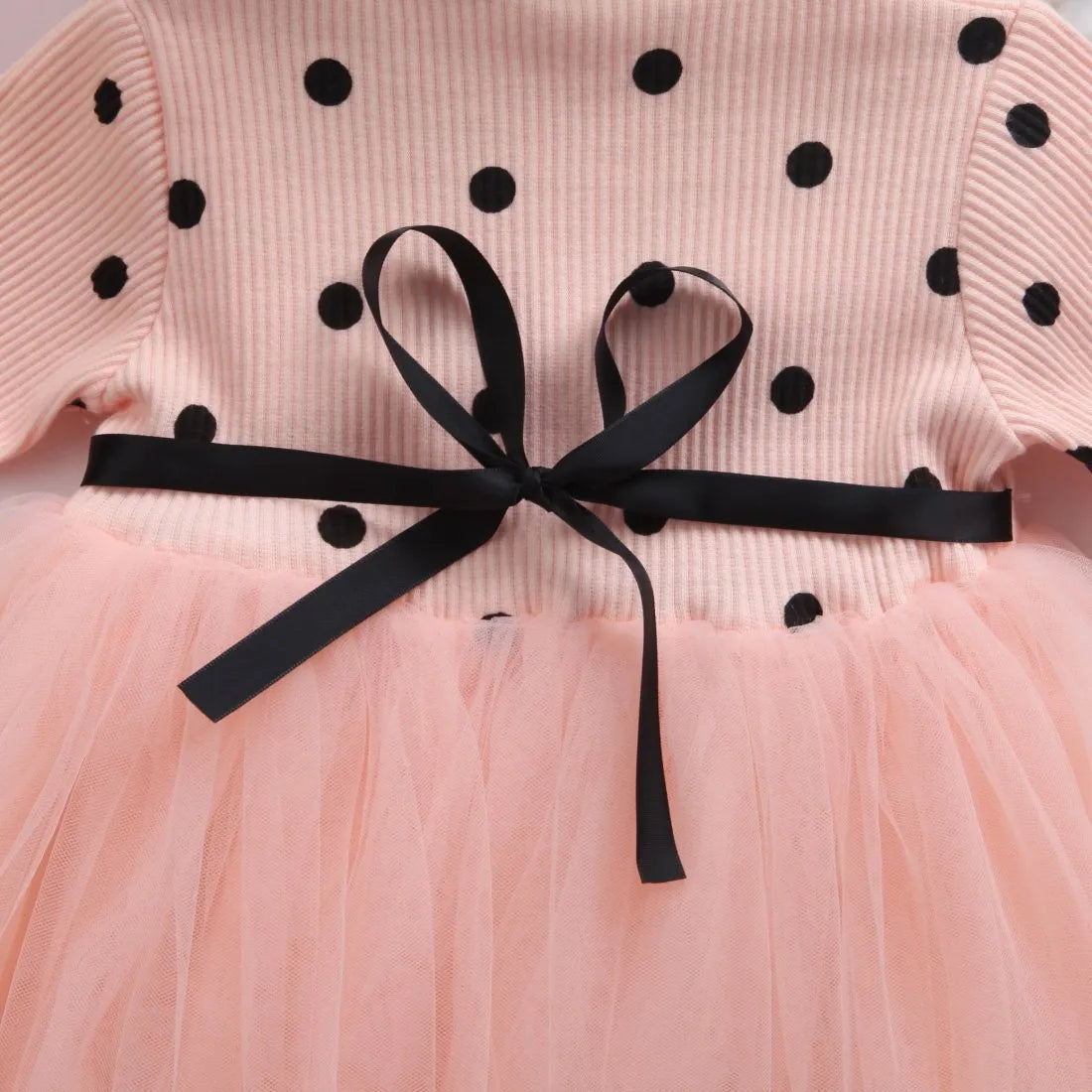 Baby girl wearing black lace tutu dress with long sleeves for birthday party