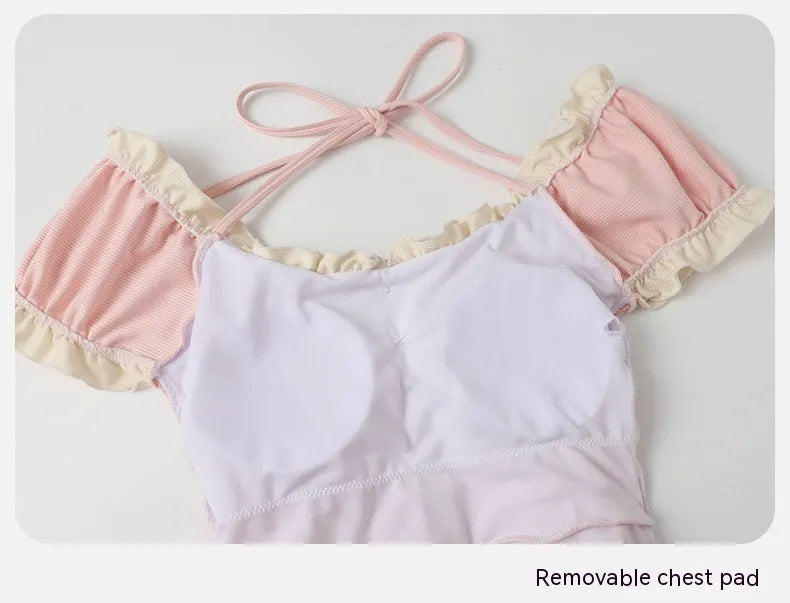 Women's pink conservative one-piece swimsuit made from nylon fabric