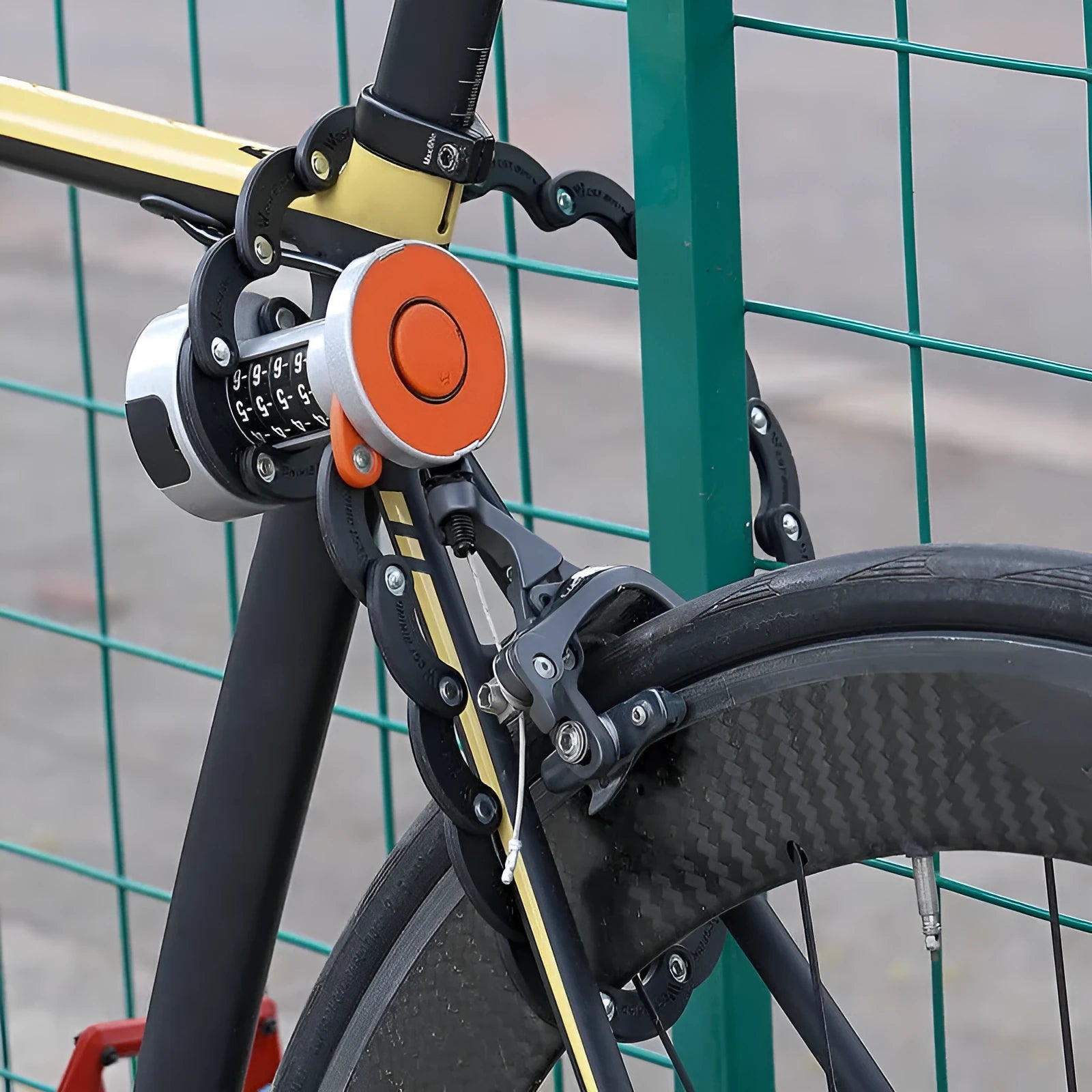 Black folding bicycle lock showing compact folded and extended positions for bike security